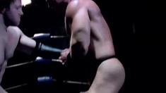 Two hunky wrestlers suck each other off in the ring