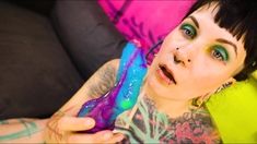 Tattooed model Illuz tests out her toys